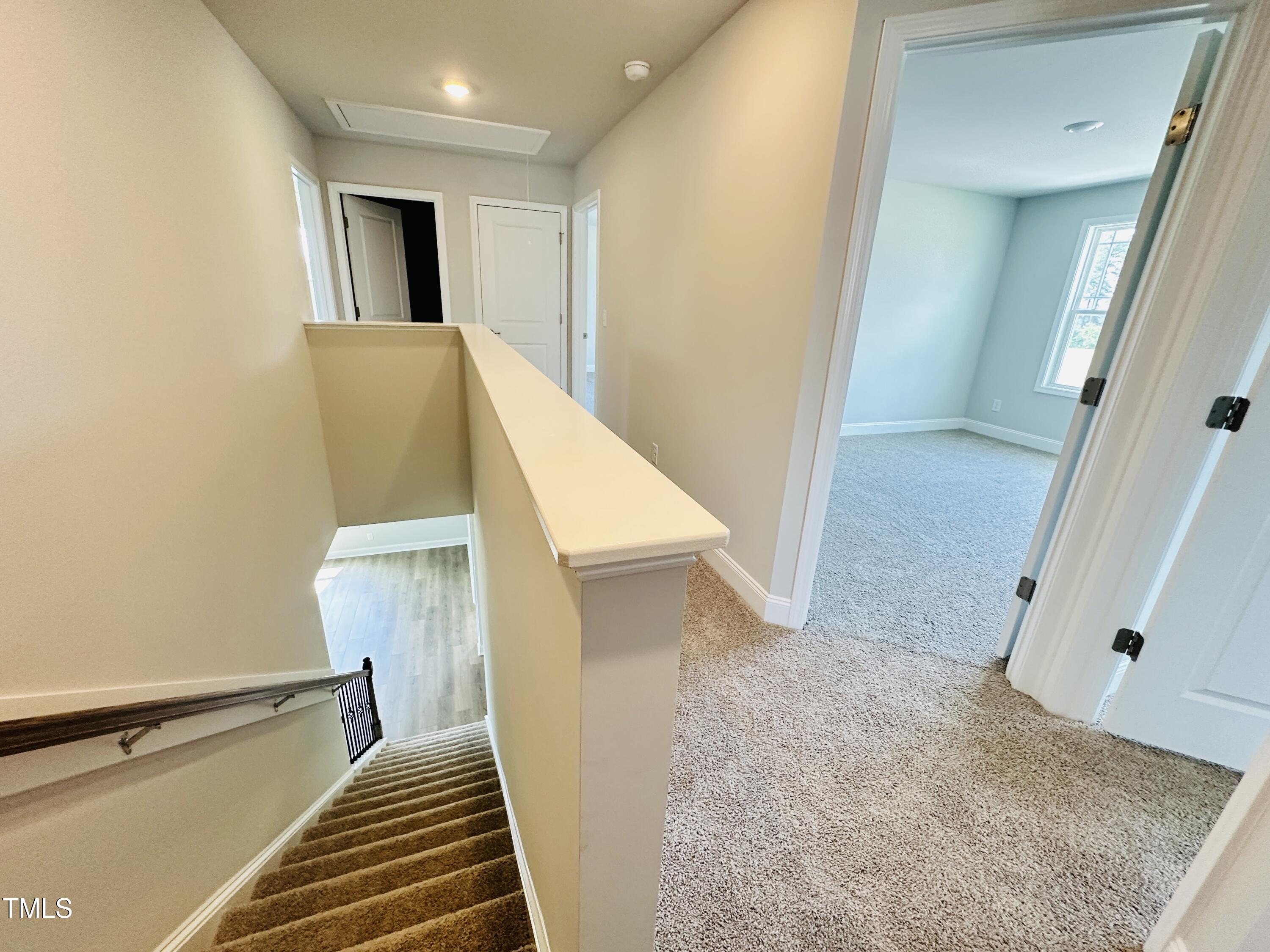3982 Fletcher Road Bailey, NC 27807 - Photo 13 of 28 a view of hallway with stairs and wooden floor