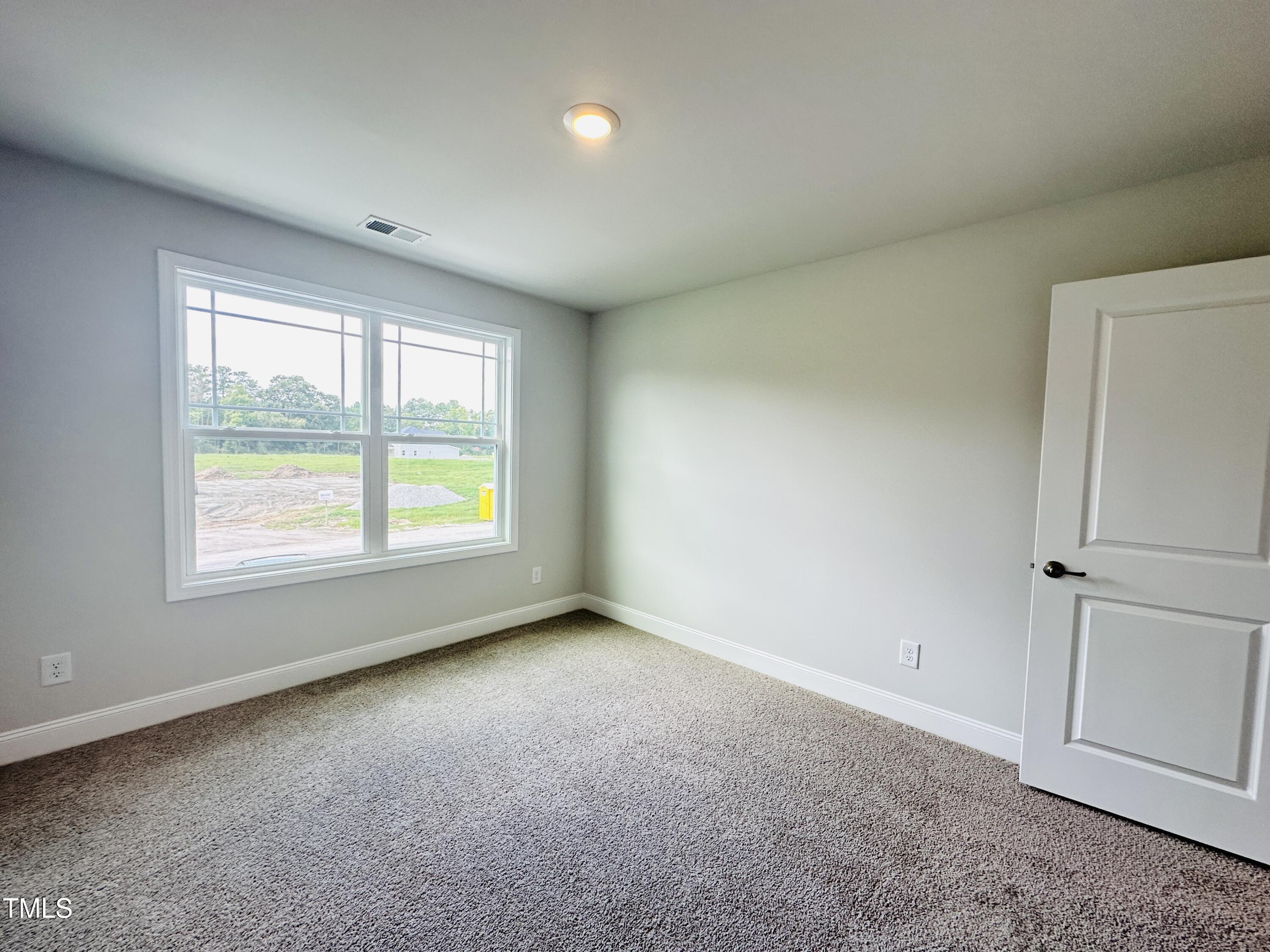 3982 Fletcher Road Bailey, NC 27807 - Photo 16 of 28 an empty room with windows