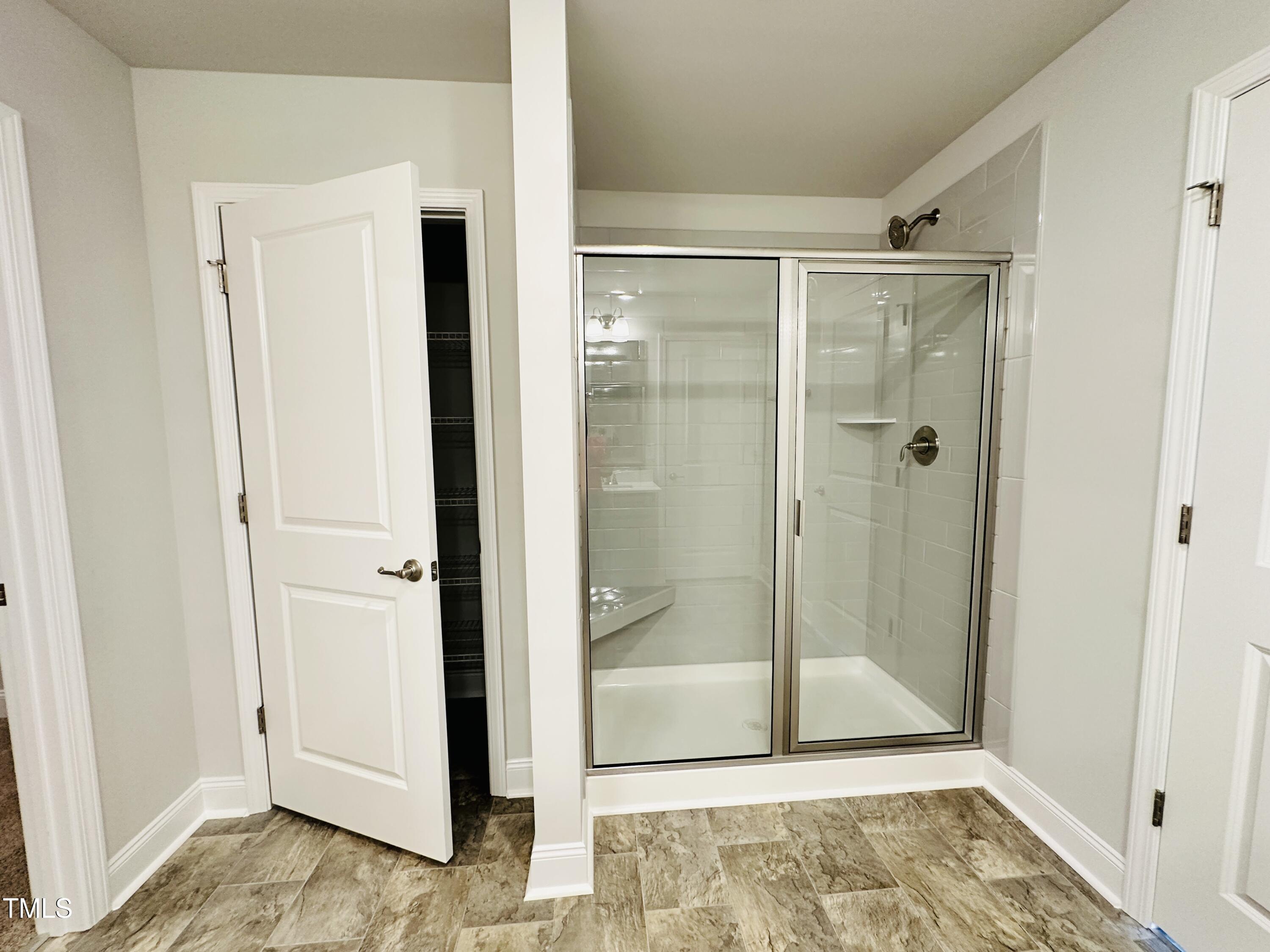 3982 Fletcher Road Bailey, NC 27807 - Photo 21 of 28 a bathroom with a glass shower door