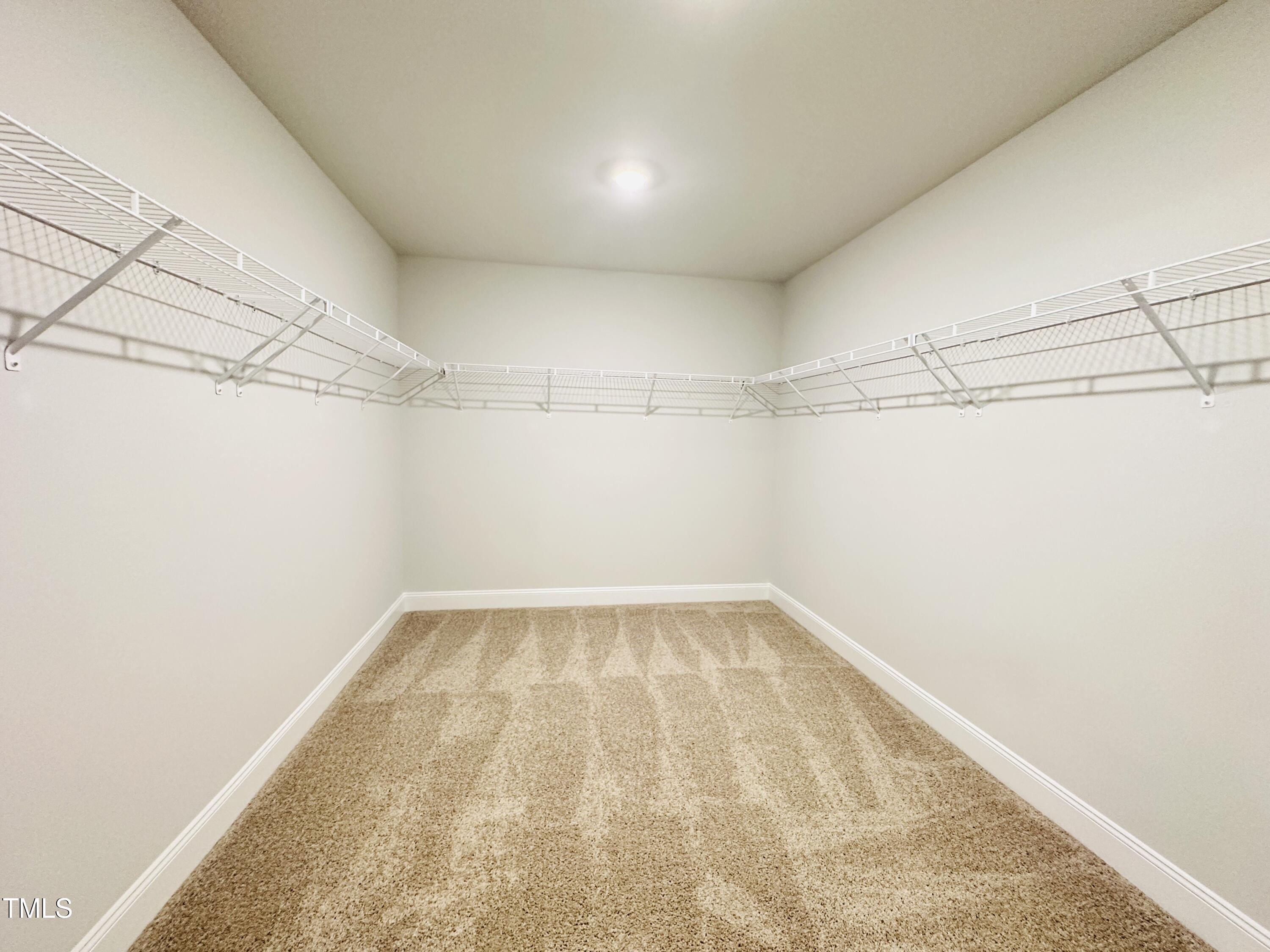 3982 Fletcher Road Bailey, NC 27807 - Photo 22 of 28 a view of a room with racks on the wall