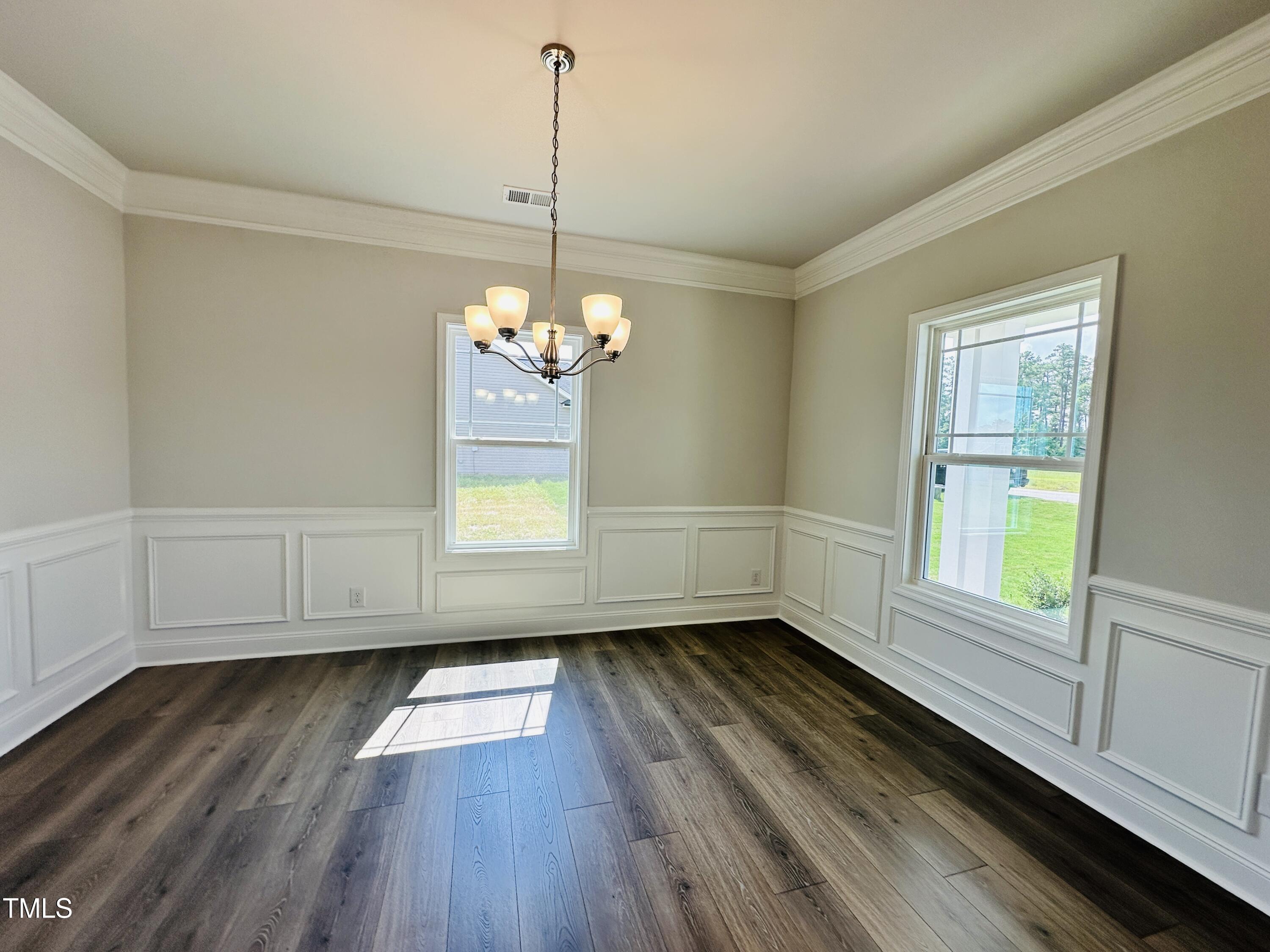 3982 Fletcher Road Bailey, NC 27807 - Photo 3 of 28 a view of an empty room with a window and wooden floor
