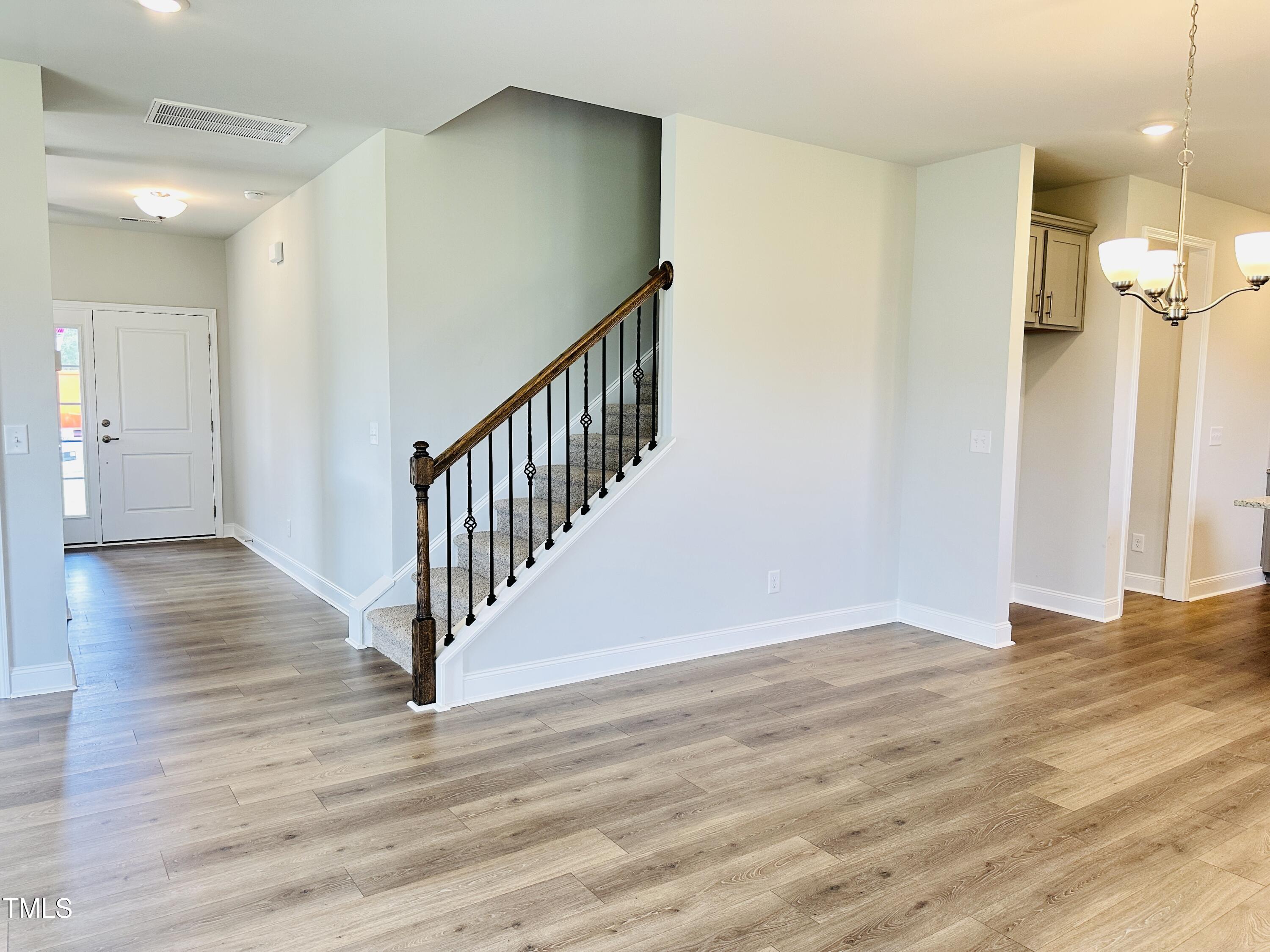 3982 Fletcher Road Bailey, NC 27807 - Photo 9 of 28 a view of a hallway with wooden floor