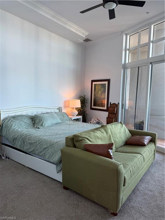 2797 First Street, Unit 2105 Fort Myers, FL 33916 - Photo 11 of 18 Carpeted bedroom with floor to ceiling windows, a ceiling fan, and crown molding