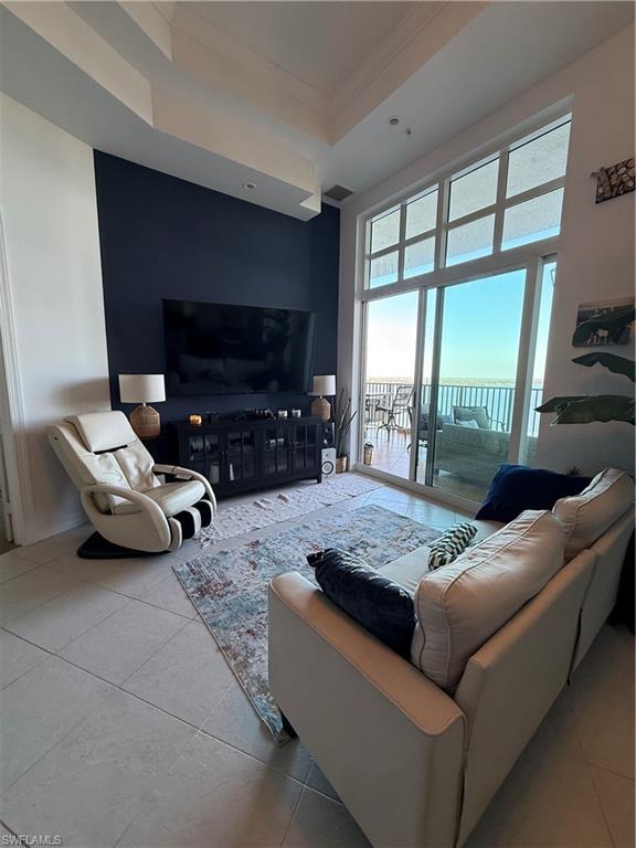 2797 First Street, Unit 2105 Fort Myers, FL 33916 - Photo 14 of 18 Tiled living area with ornamental molding and a tray ceiling