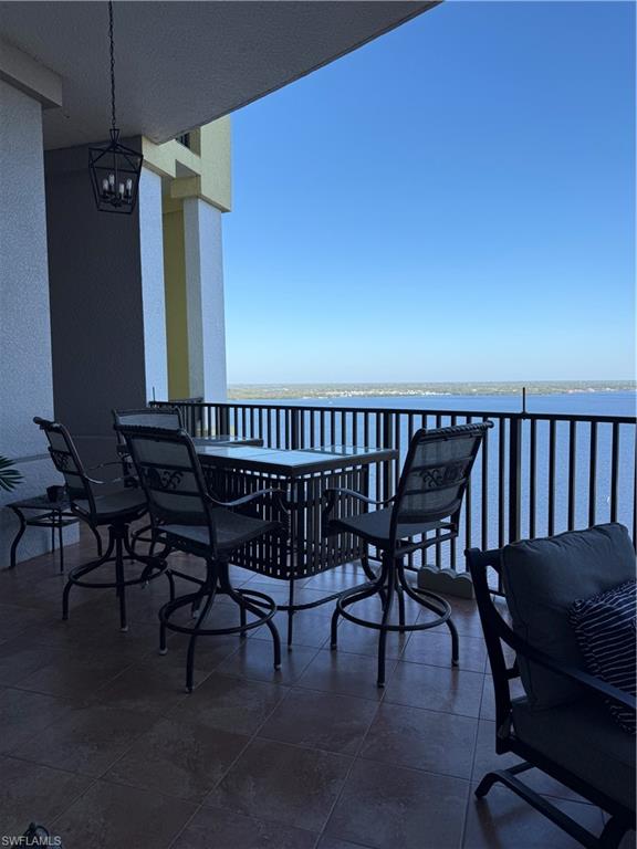 2797 First Street, Unit 2105 Fort Myers, FL 33916 - Photo 18 of 18 Balcony featuring outdoor dining area and a water view