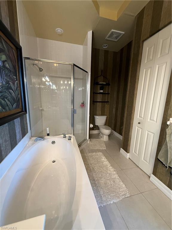 2797 First Street, Unit 2105 Fort Myers, FL 33916 - Photo 6 of 18 Full bath featuring a garden tub, light tile patterned floors, and a stall shower