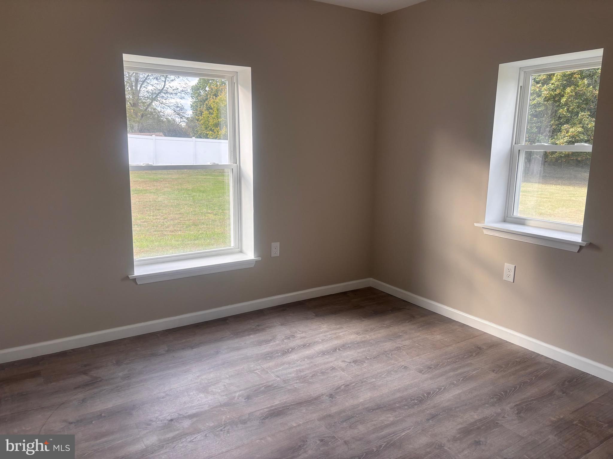 113 1/2 North Hook Road Pennsville, NJ 08070 - Photo 11 of 11 an empty room with a window