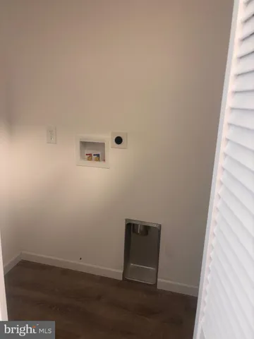 a view of a small space with wooden floor