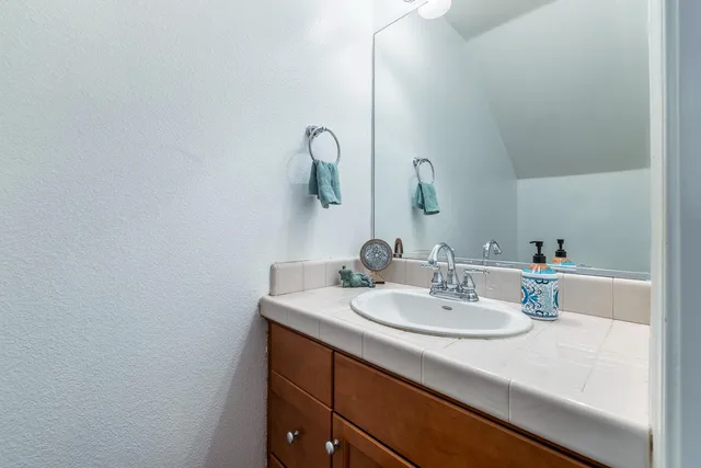a bathroom with a sink and a mirror