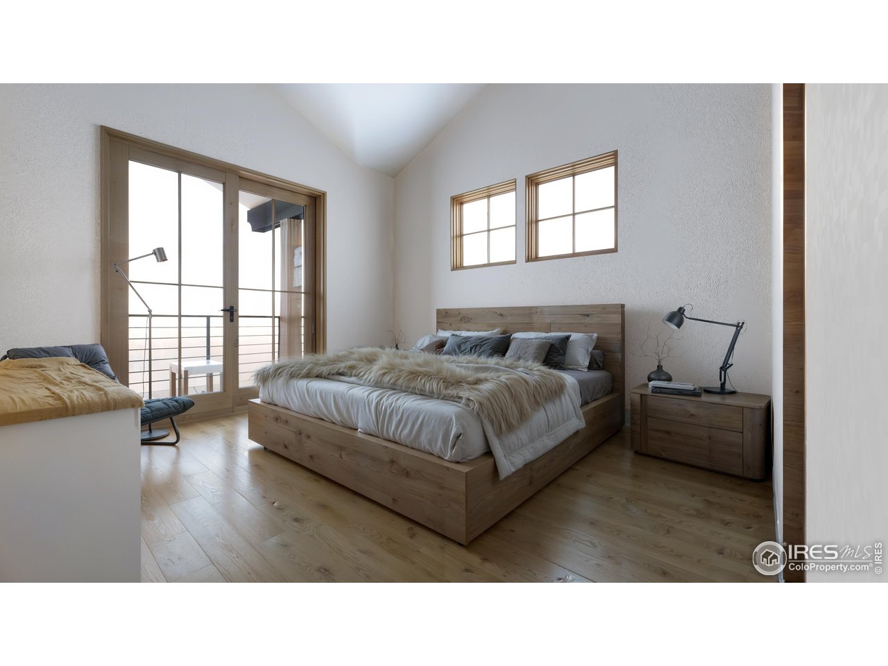 185 Vasquez Road, Unit A3 Winter Park, CO 80482 - Photo 17 of 20 a living room with a bed furniture and a window