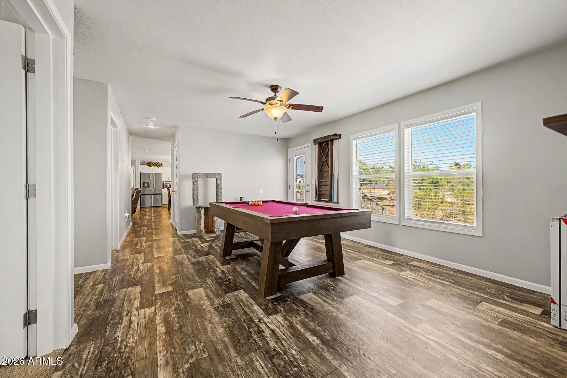 22417 West Dove Valley Road Wittmann, AZ 85361 - Photo 14 of 53 a living room with furniture and a large window