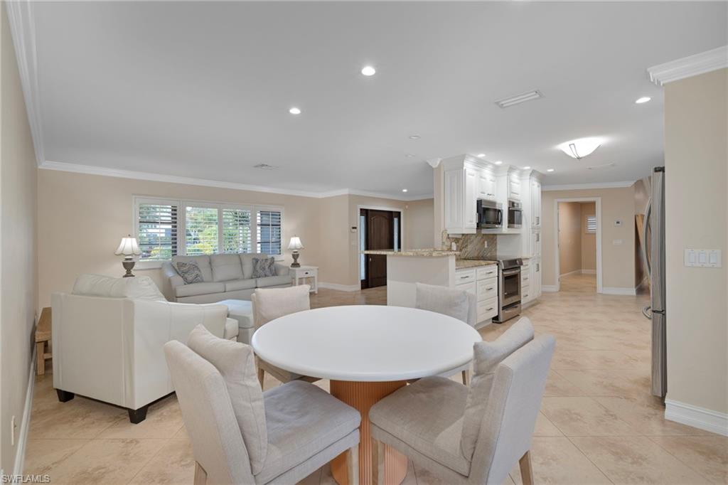 6440 Sable Ridge Lane Naples, FL 34109 - Photo 5 of 20 Dining room featuring recessed lighting, ornamental molding, and light tile patterned floors