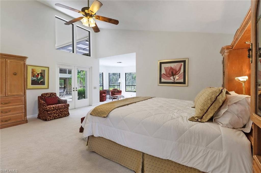 12902 Valewood Drive Naples, FL 34119 - Photo 11 of 22 a bedroom with a bed dresser and window