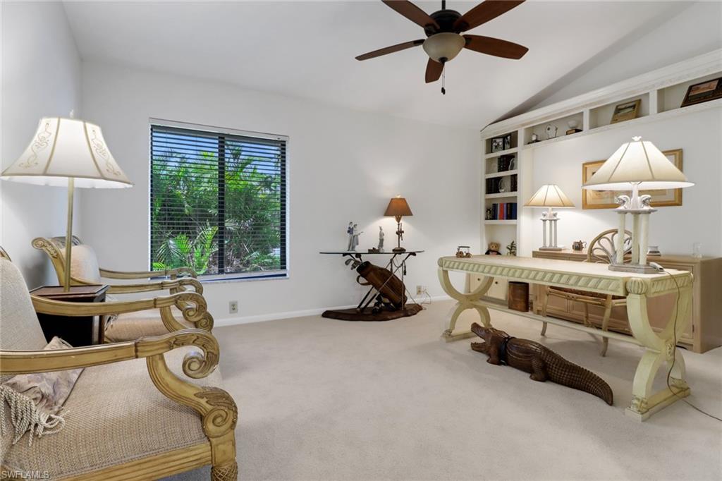 12902 Valewood Drive Naples, FL 34119 - Photo 17 of 22 a room with gym equipment and a window