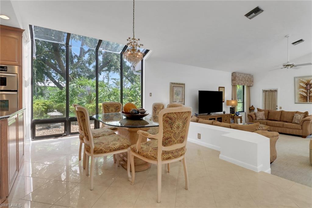 12902 Valewood Drive Naples, FL 34119 - Photo 9 of 22 a view of a livingroom with furniture window and outside view