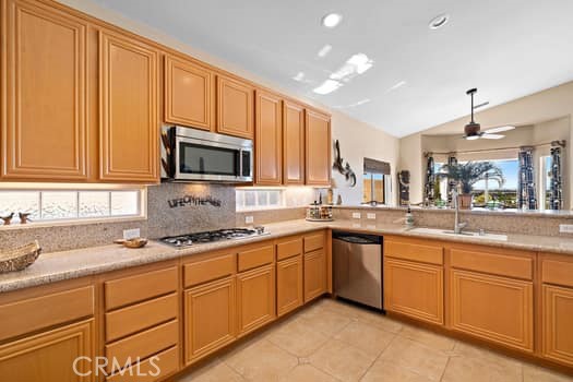 2710 Colorado River Road Blythe, CA 92225 - Photo 14 of 38 a kitchen with sink cabinets and window