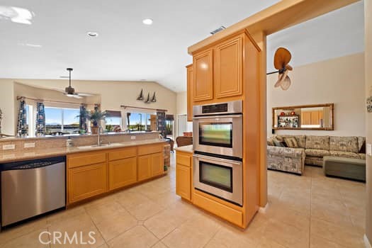 2710 Colorado River Road Blythe, CA 92225 - Photo 15 of 38 a kitchen with stainless steel appliances granite countertop a stove and more cabinets