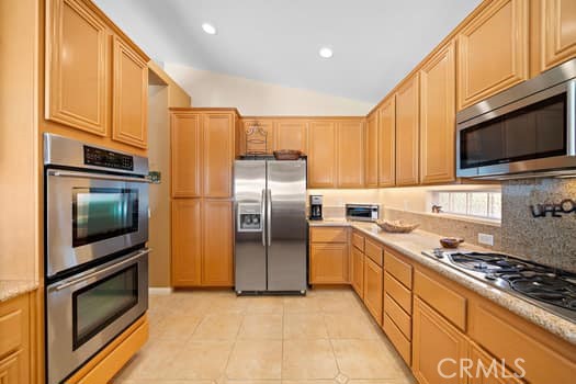 2710 Colorado River Road Blythe, CA 92225 - Photo 17 of 38 a kitchen with stainless steel appliances granite countertop a stove a refrigerator and a microwave