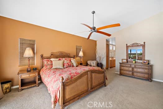 2710 Colorado River Road Blythe, CA 92225 - Photo 20 of 38 a bedroom with a bed and a chandelier