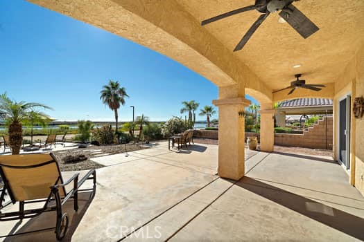 2710 Colorado River Road Blythe, CA 92225 - Photo 28 of 38 a view of a patio with a table and chairs under an umbrella