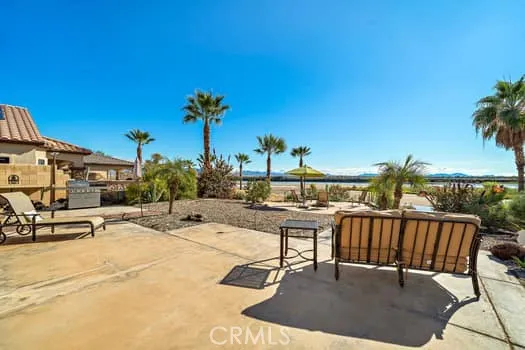 an outdoor space with furniture and city view