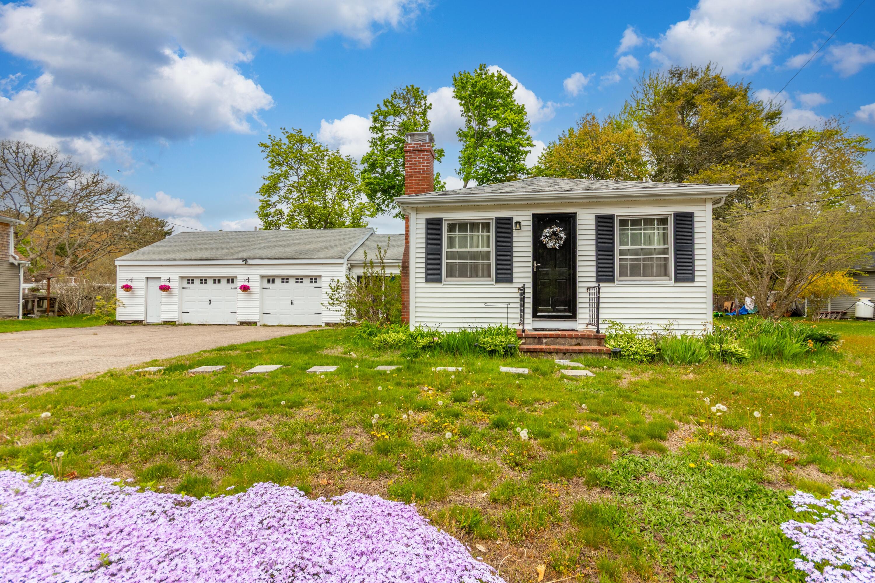 1003 Point Road Marion, MA 02738 - Photo 1 of 30 a front view of a house with garden