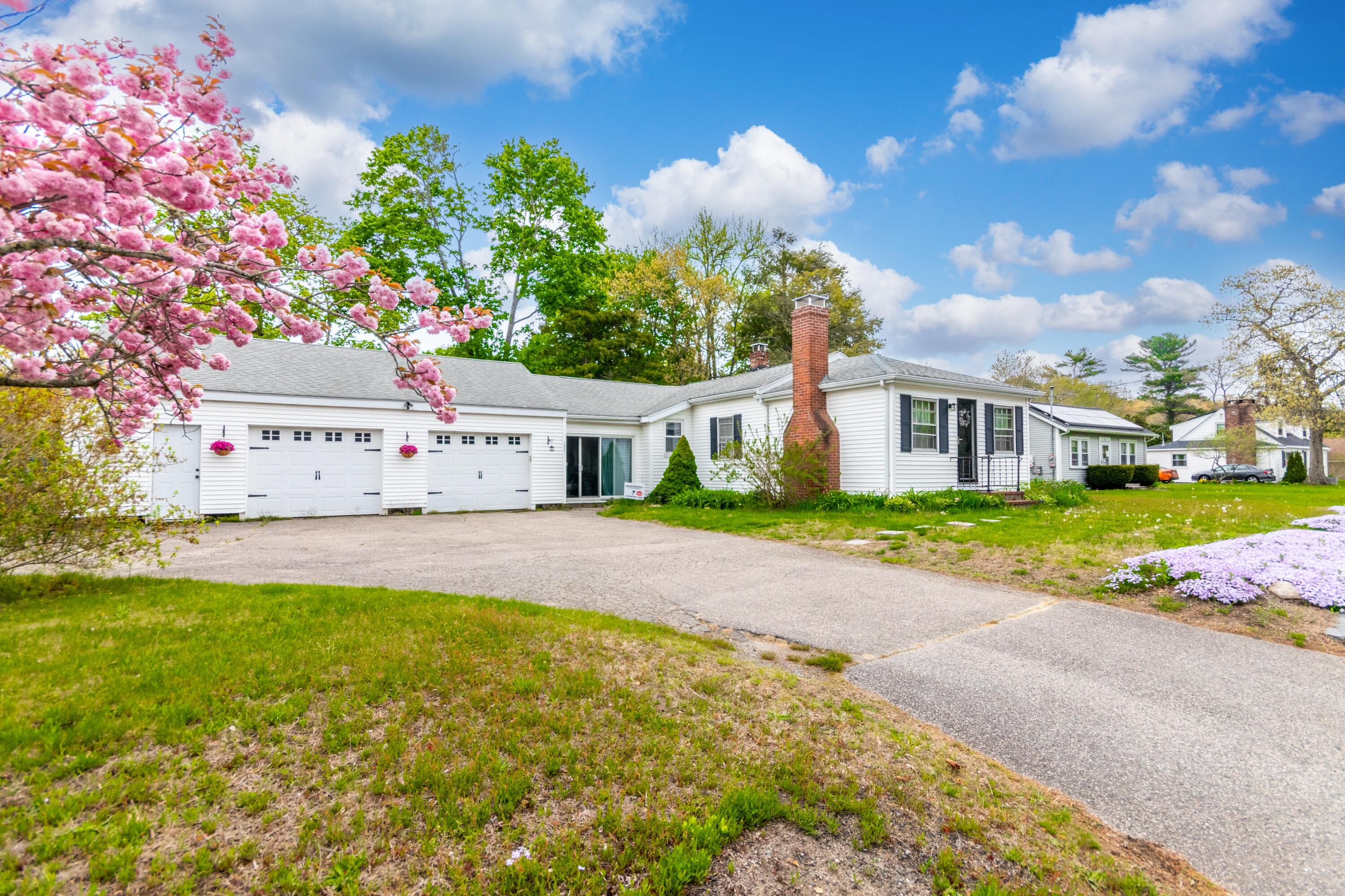 1003 Point Road Marion, MA 02738 - Photo 2 of 30 a white house with a big yard and large trees