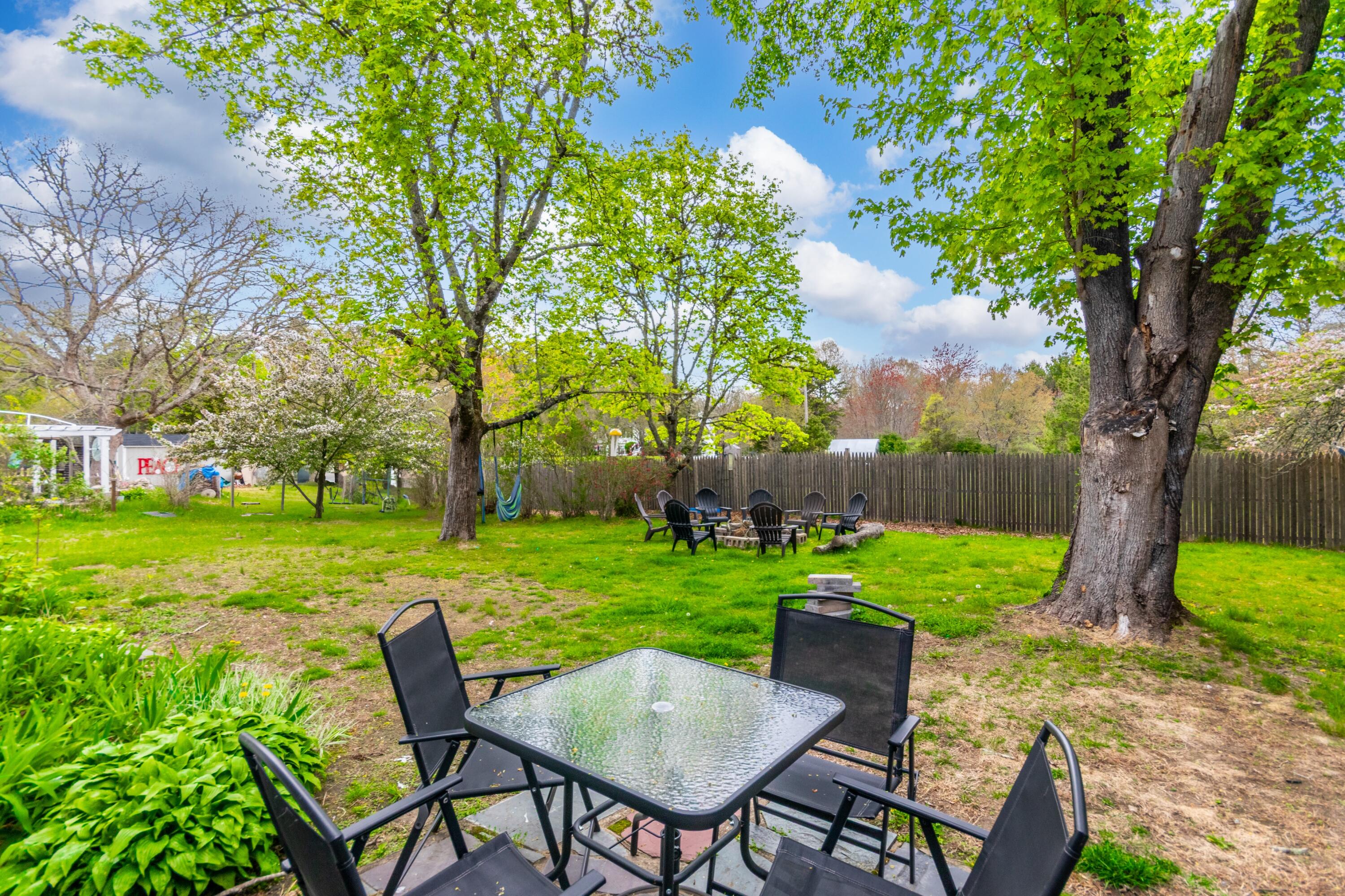1003 Point Road Marion, MA 02738 - Photo 28 of 30 a view of a chairs and table in the garden