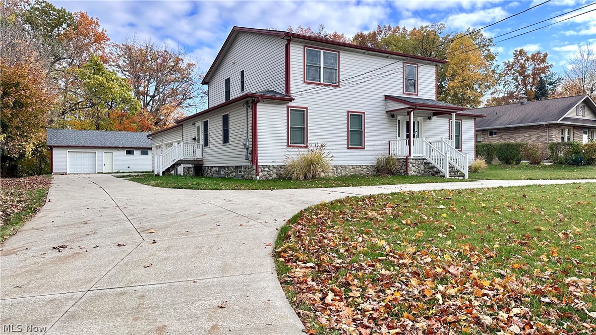 2603 Rockefeller Road Wickliffe, OH 44092 - Photo 1 of 34 White siding exterior with red trim accents