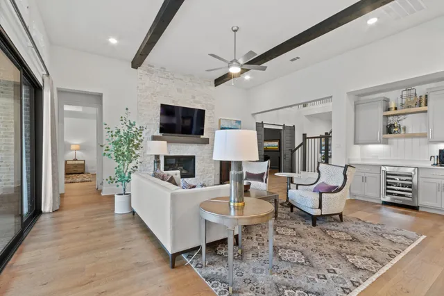 a kitchen with cabinets and wooden floor