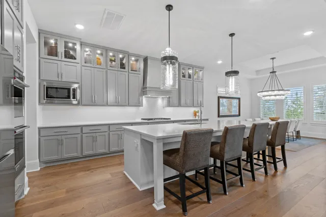 a kitchen with cabinets and window