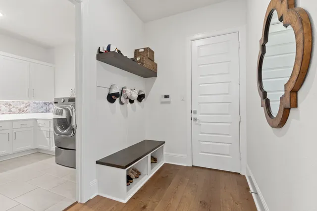 a bathroom with a toilet a sink and a mirror
