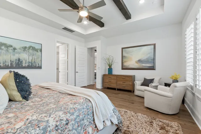 a bathroom with a granite countertop toilet a sink and a mirror