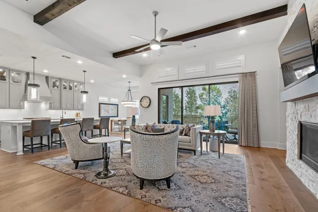 a living room with fireplace furniture and a flat screen tv