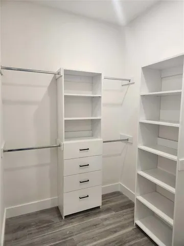 a view of an empty walk in closet