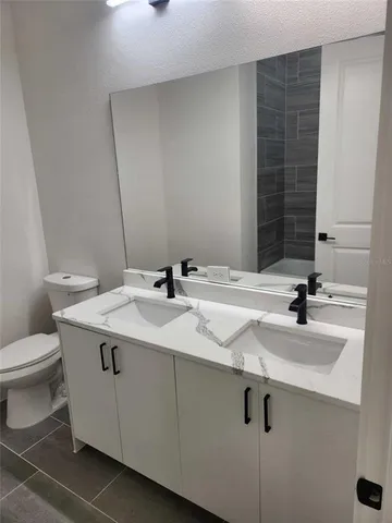 a bathroom with a sink and a toilet