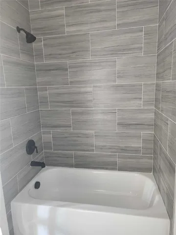 a close up of a bathtub in a bathroom