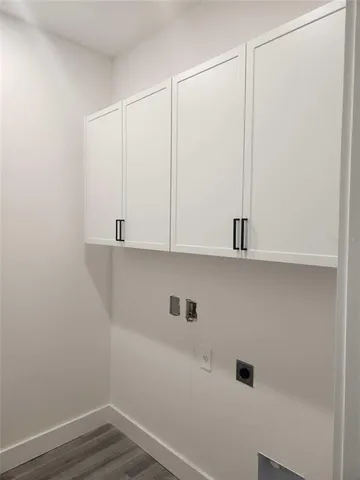 a view of cabinets and wooden floor