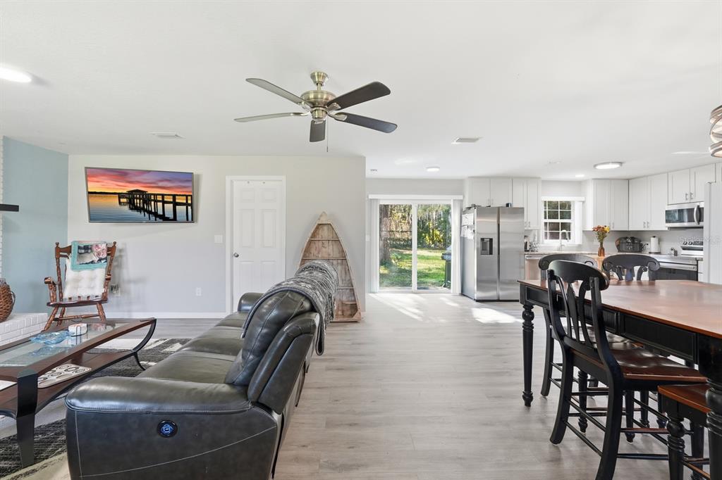 270 Wright Grove Road Oak Hill, FL 32759 - Photo 8 of 13 a living room with furniture a window and a flat screen tv