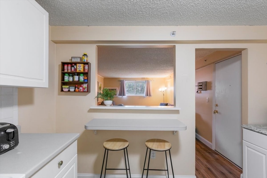 25 Clark's Road, Unit 101 Amesbury, MA 01913 - Photo 1 of 32 a kitchen with a sink cabinets and appliances