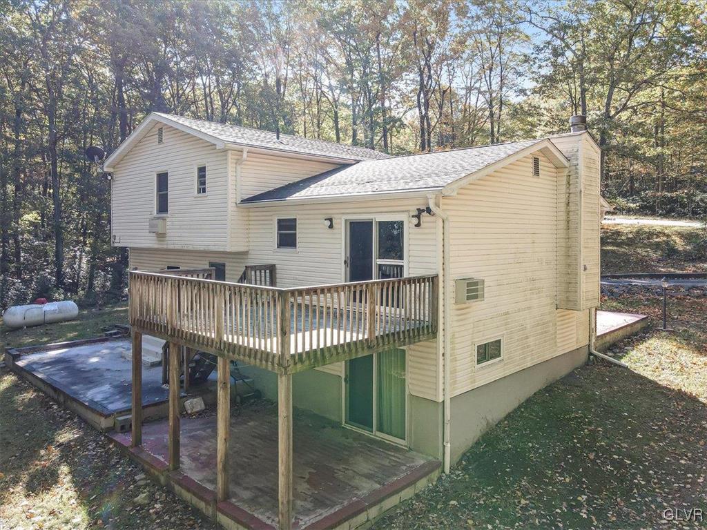 63 Holly Forest Road Mount Pocono, PA 18344 - Photo 39 of 49 a view of a house with a yard balcony and wooden fence