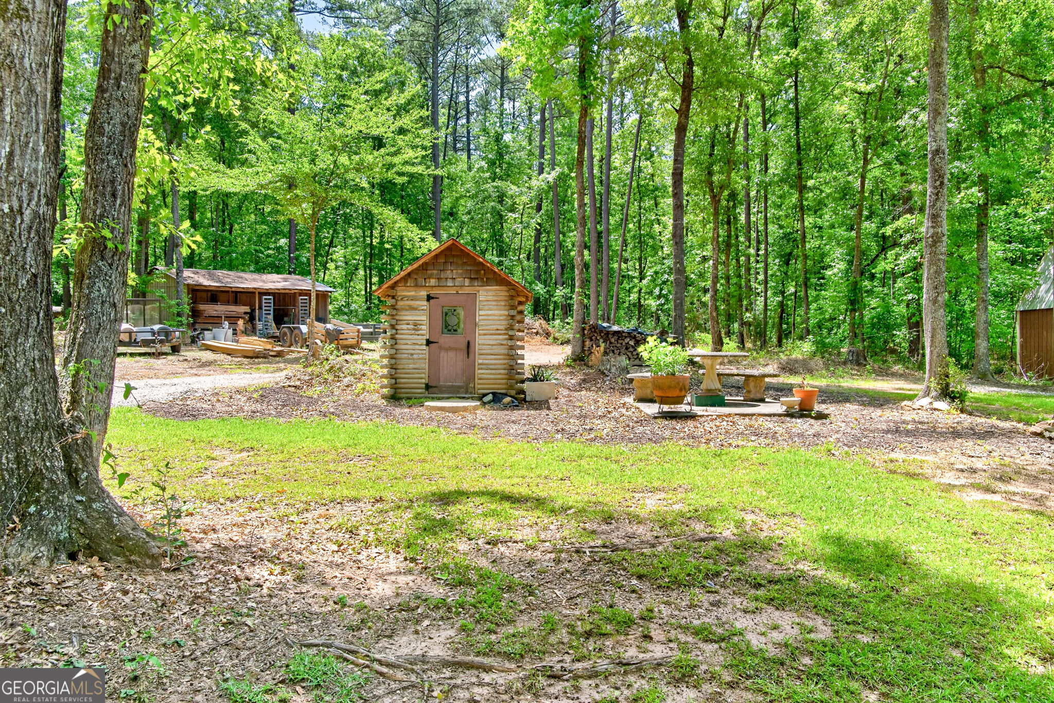 261 McIntosh Circle Jackson, GA 30233 - Photo 58 of 77 a backyard of a house with seating space