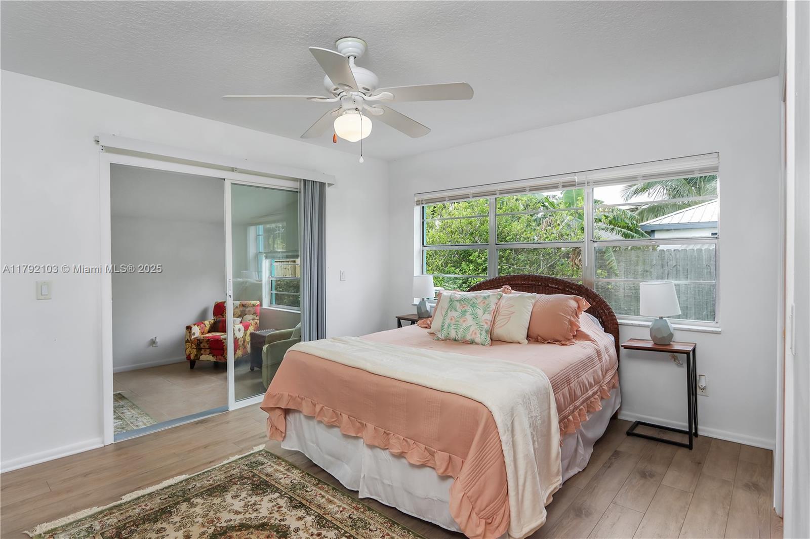 1115 Hernando Street Fort Pierce, FL 34949 - Photo 22 of 24 a bedroom with a bed and a large window