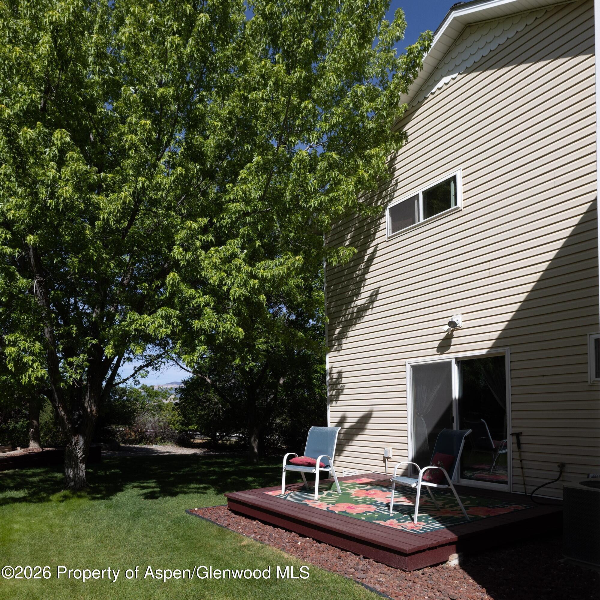 1335 Firethorn Drive Rifle, CO 81650 - Photo 19 of 30 a front view of a house with a garden