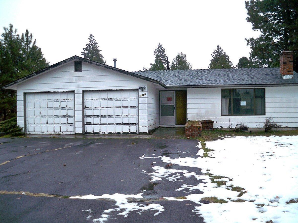 61450 Southwest Blakely Road Bend, OR 97702 - Photo 1 of 14 a front view of a house with a yard