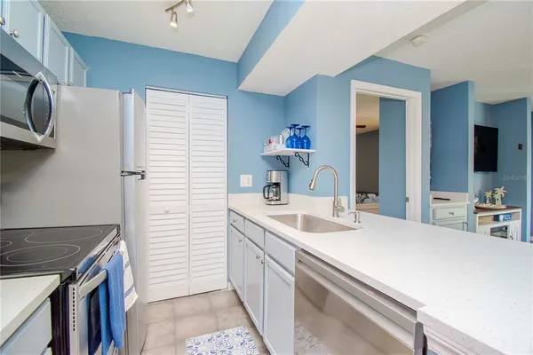 a kitchen with a sink and cabinets