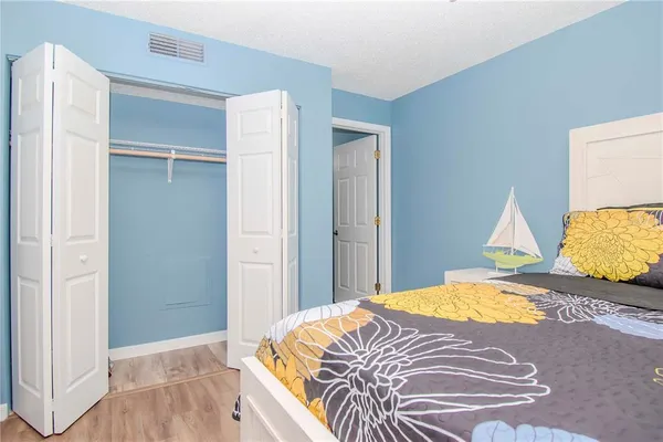 a bedroom with a bed and a walk in closet