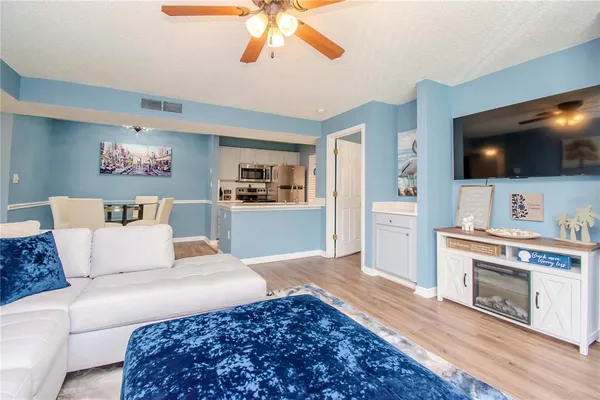 a bedroom with a large bed and a flat screen tv