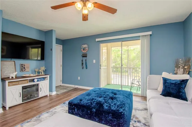 a spacious bedroom with a large bed and a flat screen tv