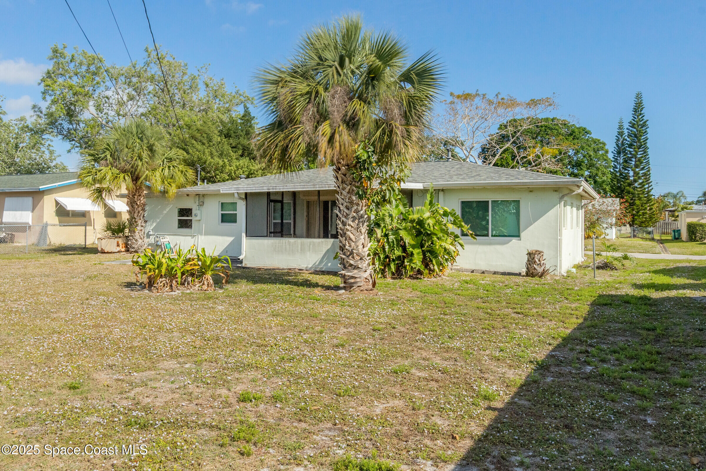 407 Bunker Street Melbourne, FL 32901 - Photo 5 of 26 a front view of a house with garden